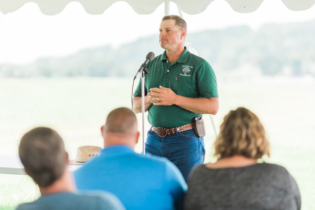 speaker giving talk at Sunrise Farms event